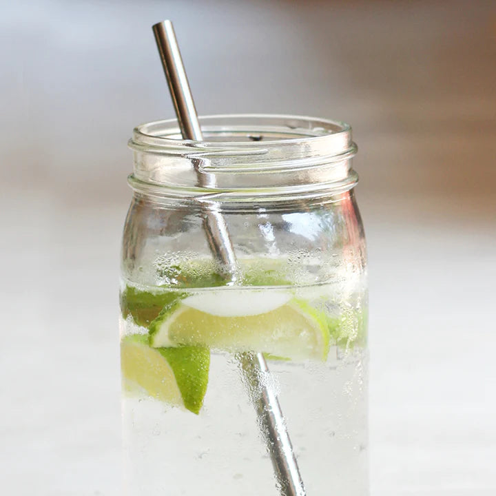 U-Konserve Straw in a Mason Jar full of ice water and lime.