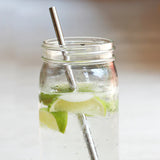U-Konserve Straw in a Mason Jar full of ice water and lime.
